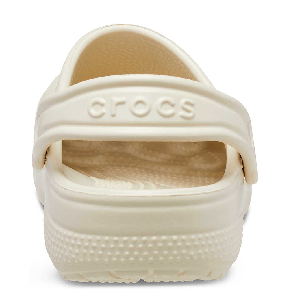 Back heel view of Crocs logo on bone coloured clogs