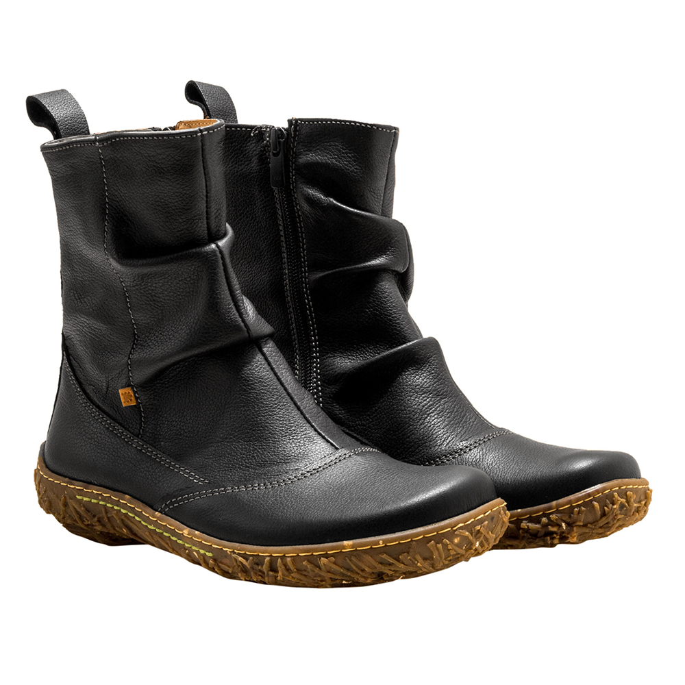 Pair of black leather boots with rubber soles on a white background