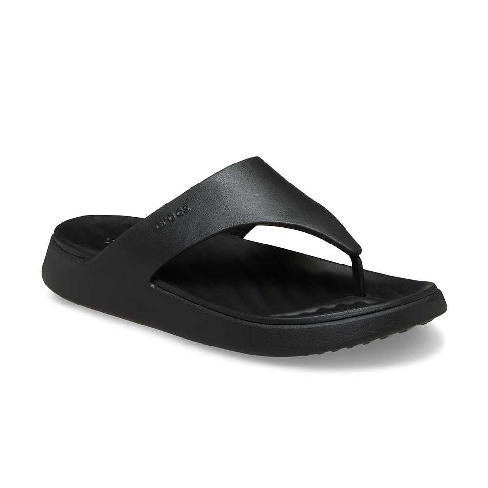 A single black slide sandal with a wide padded strap and contoured footbed, shown from a three-quarters angle on a white background.