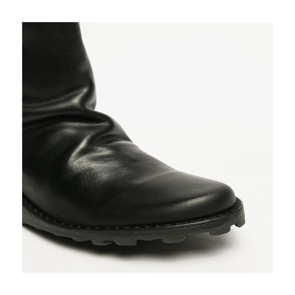 Rounded black toe view of Fly London boot