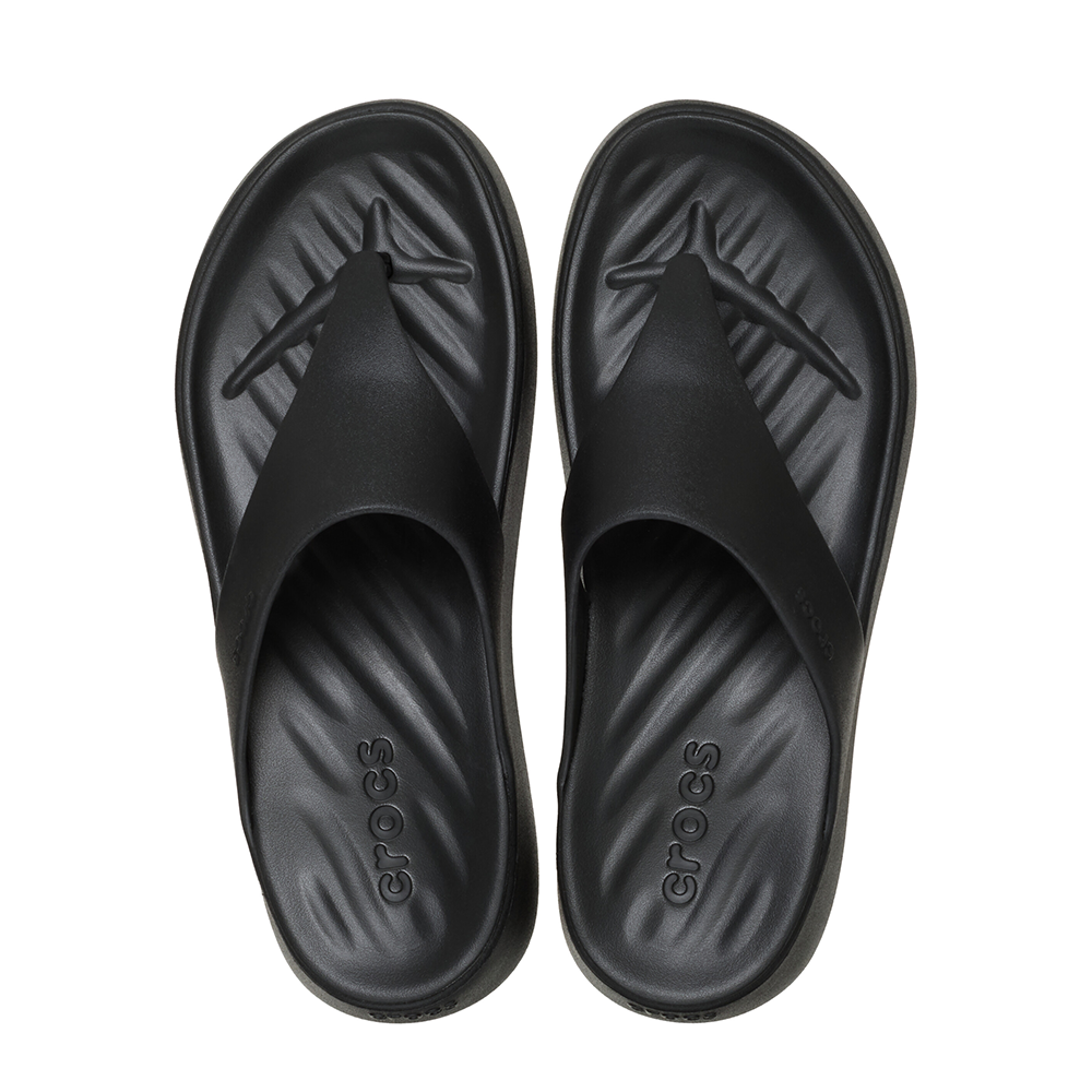 A pair of black Crocs slide sandals shown from a top-down view on a plain white background.