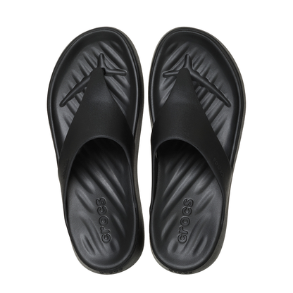 A pair of black Crocs slide sandals shown from a top-down view on a plain white background.