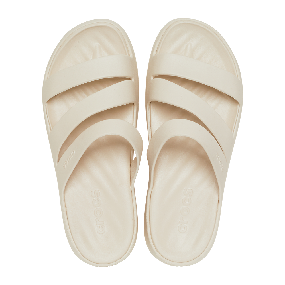 Pair of strappy Crocs open toe white sandals